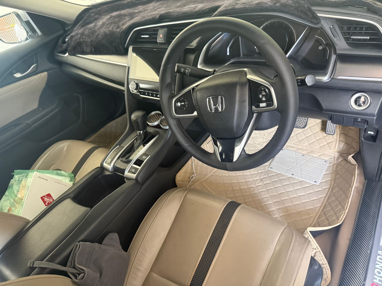 Honda cabin with leather seats, steering wheel and fitted floor mats